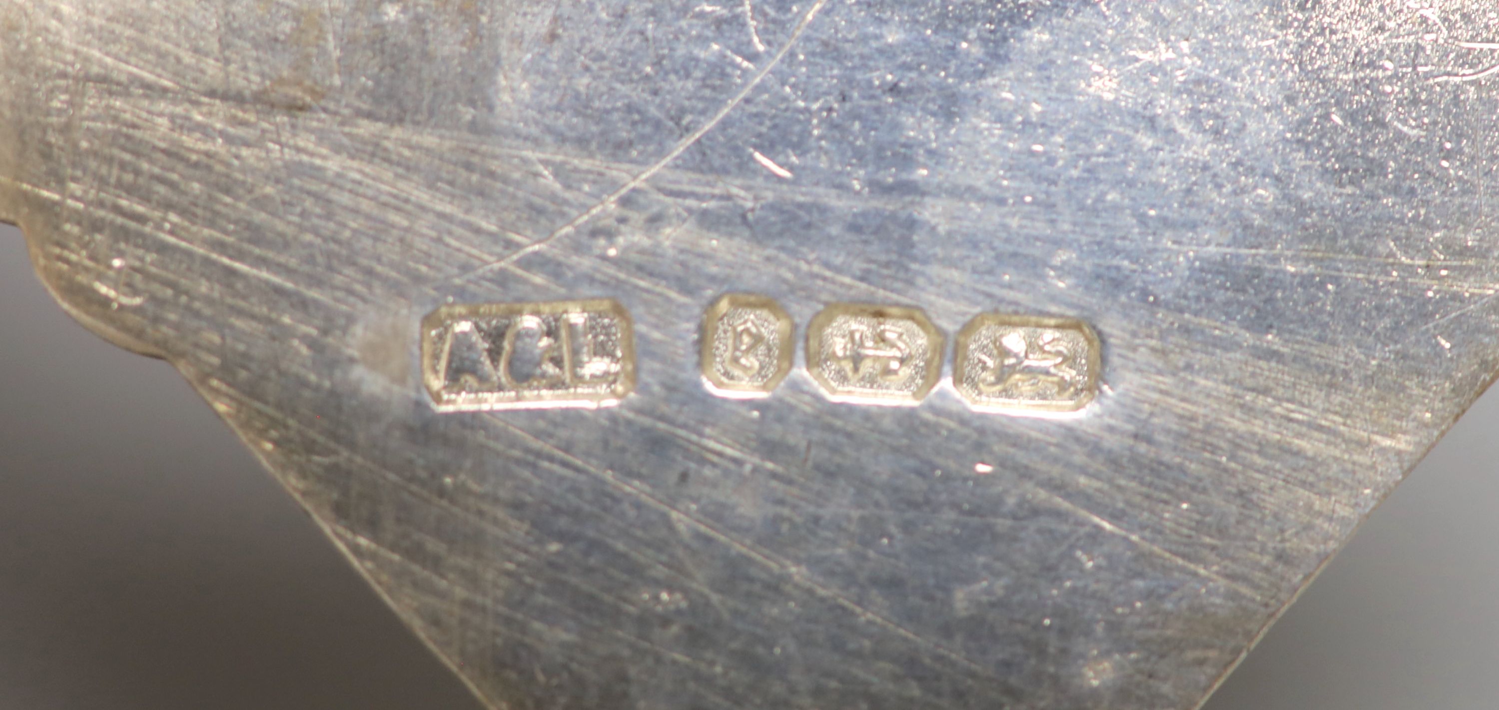 A silver trinket box with velvet-lined interior, an Anglo-Indian white metal coin purse and sundry items,